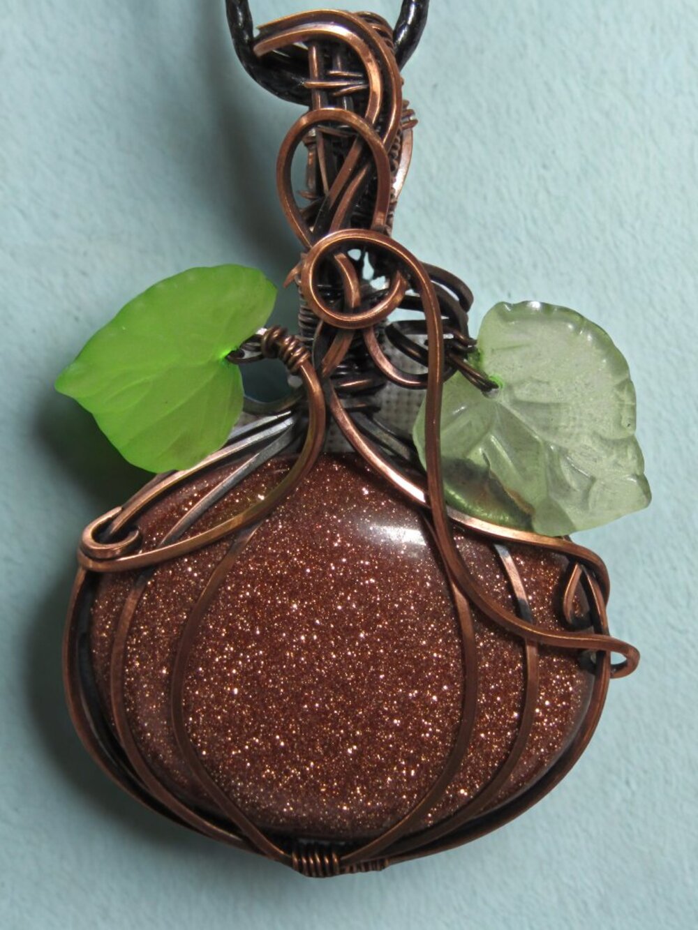 Handmade Wire Wrapped Goldstone Pumpkin pendant. Copper Wire Wrapped Crystal